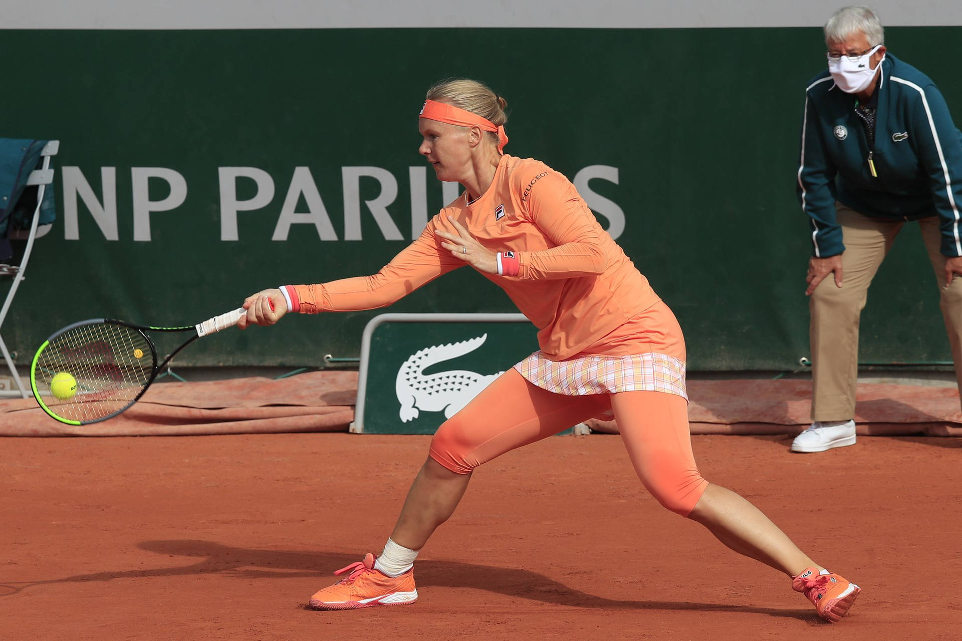 Caption: Tennis Ace Kiki Bertens In Peach Fila Outfit