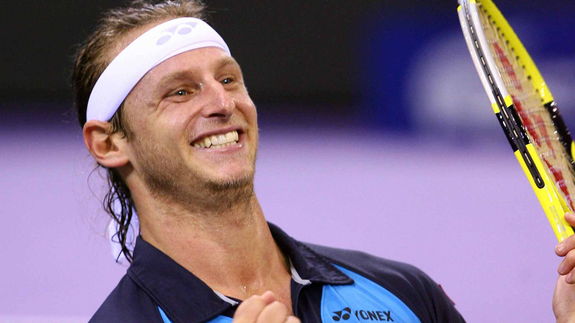 Caption: Tennis Star David Nalbandian's Winning Smile Background