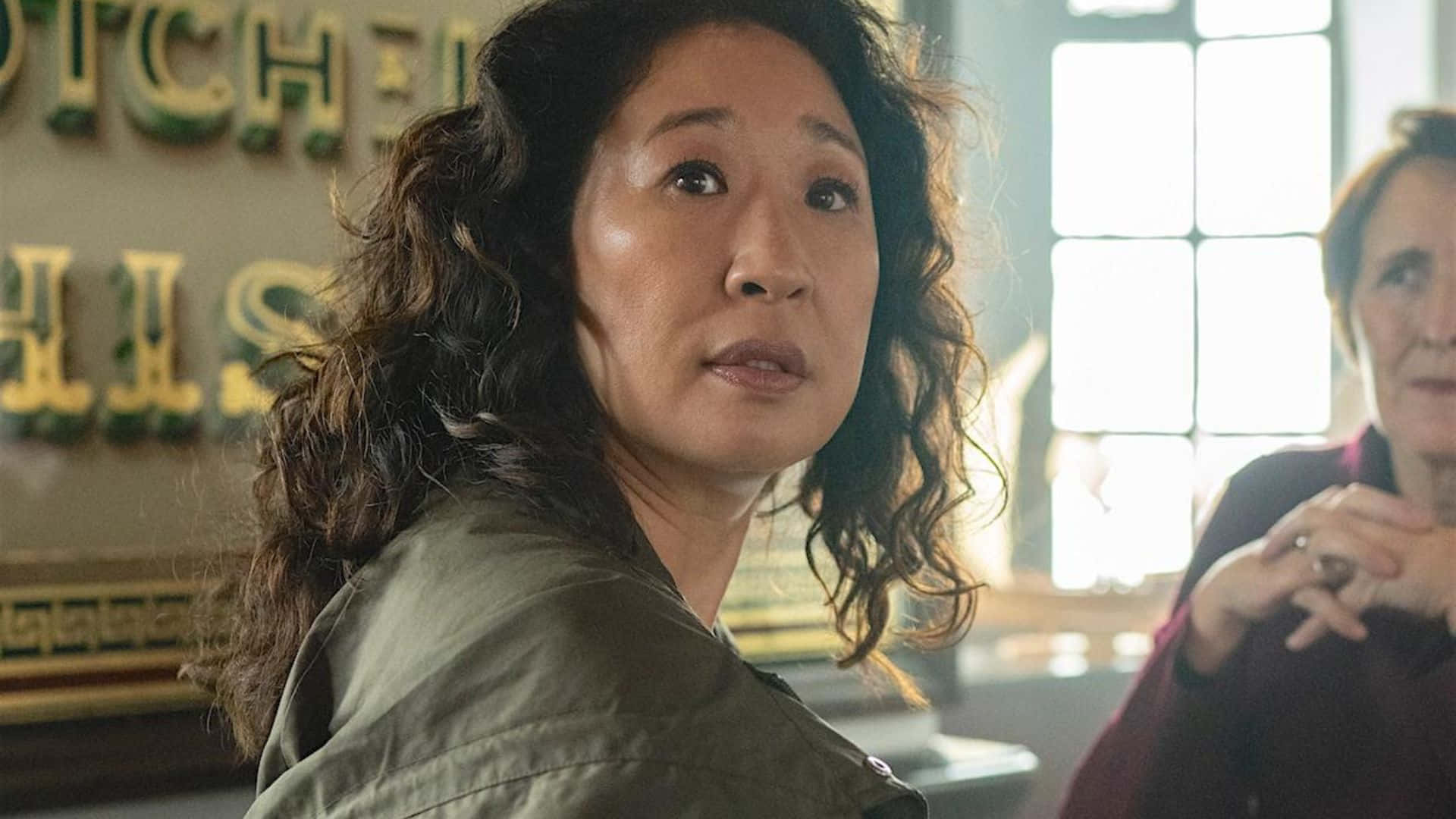 Caption: Tense Face-off Between Villanelle And Eve In Killing Eve Background