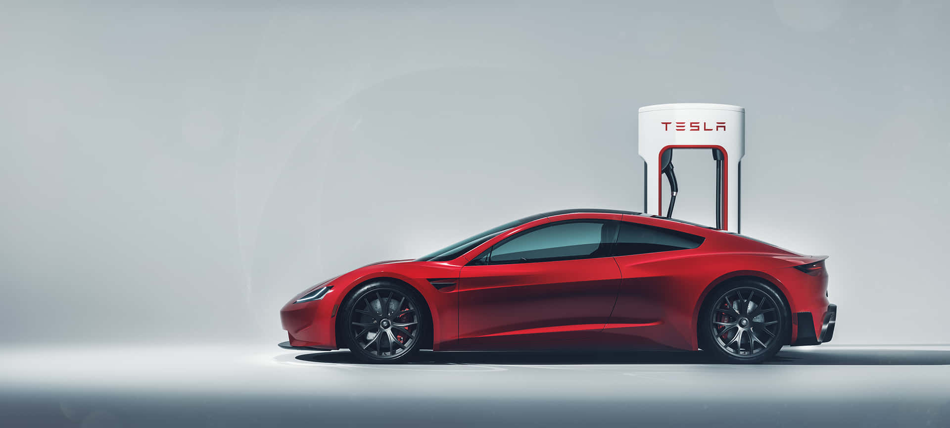Caption: Tesla Roadster - Unleashing Impeccable Innovation Background