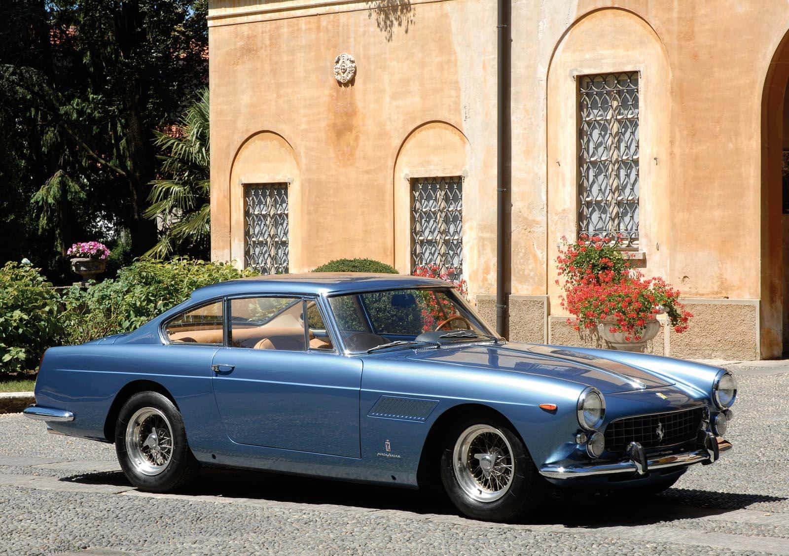 Caption: The Elegant Ferrari 330 Unleashing Power And Performance Background