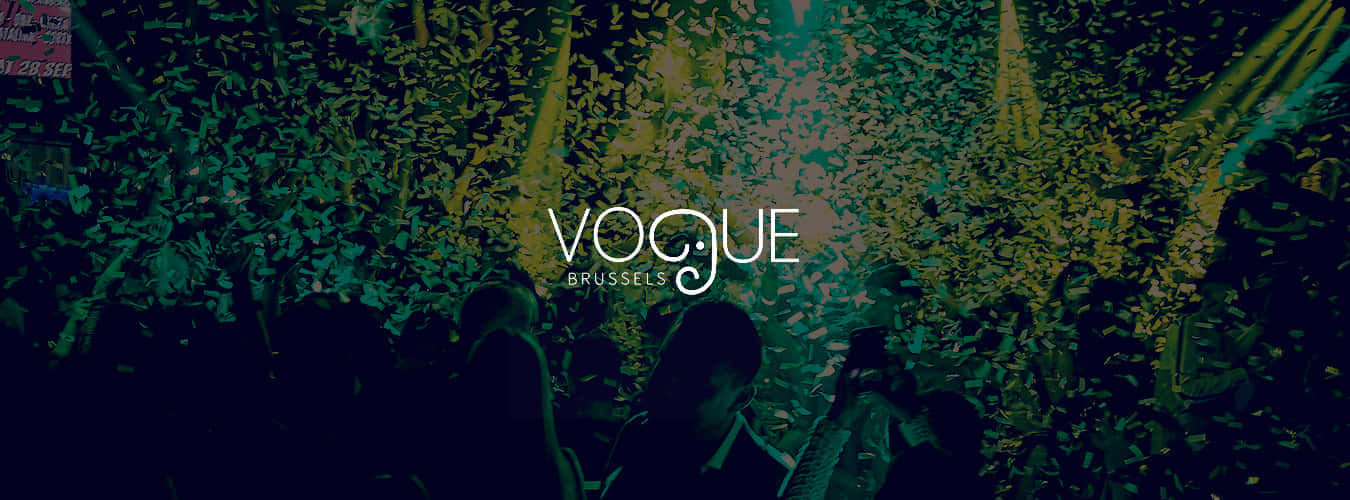 Caption: The Elegant Vogue Logo In Its Iconic Serif-font, Symbolizing The Epitome Of Fashion Journalism. Background