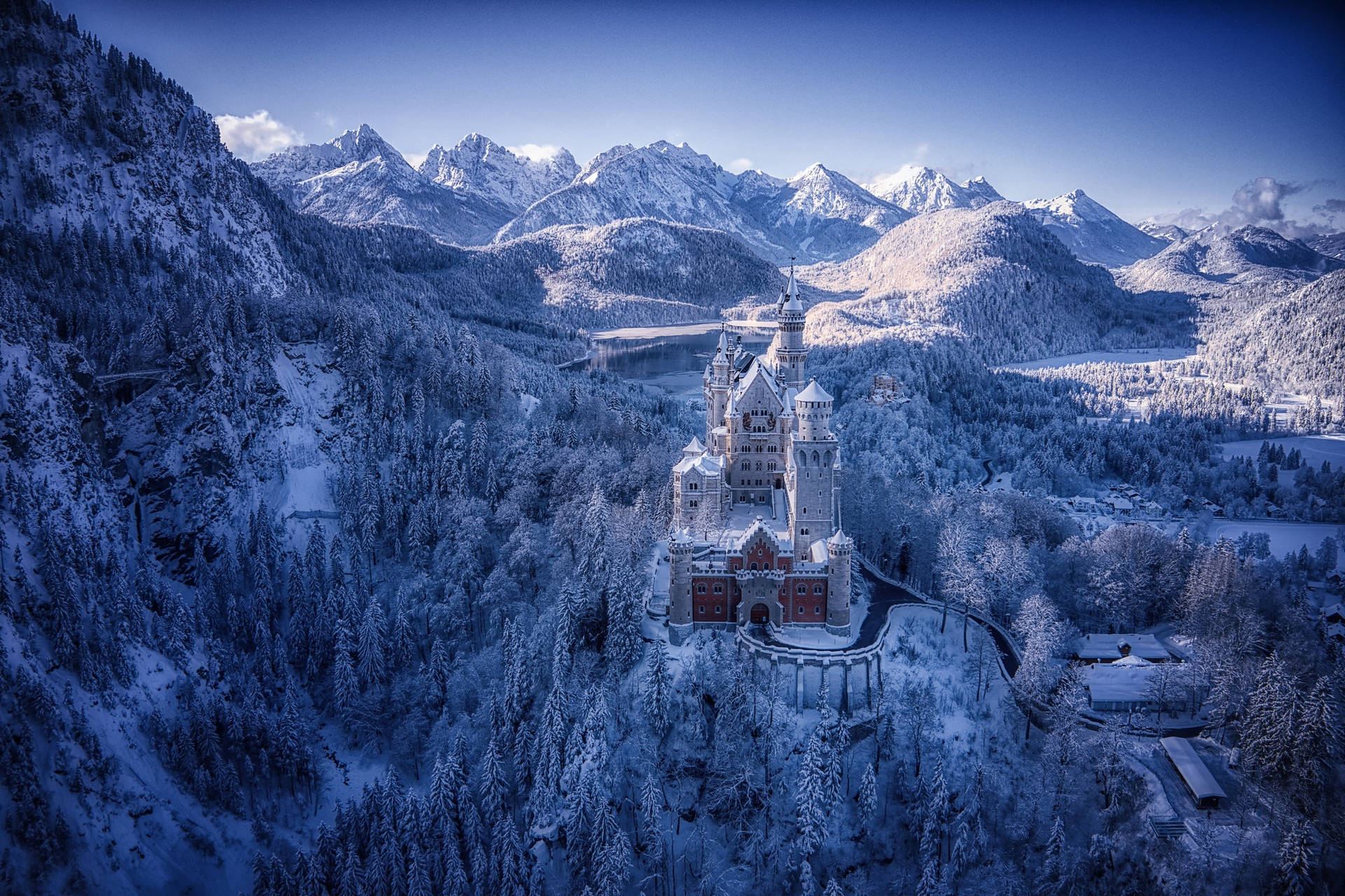 Caption: The Iconic Neuschwanstein Castle Encapsulated In Winter Elegance Background