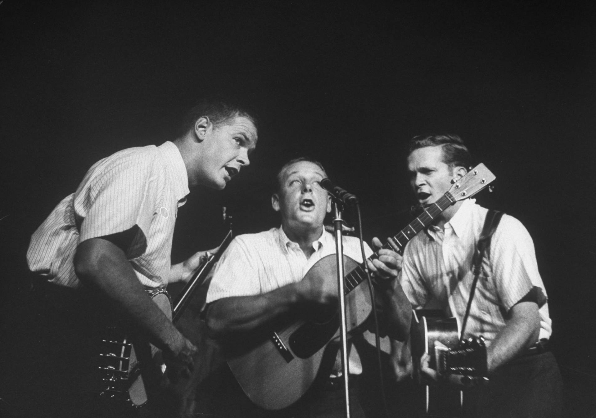 Caption: The Kingston Trio Performing On Stage In The 1970s