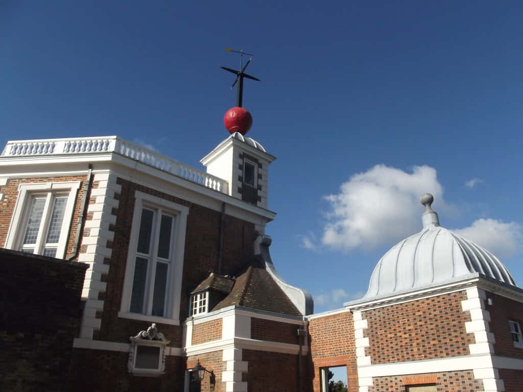 Caption: The Royal Observatory Under A Starlit Sky Background