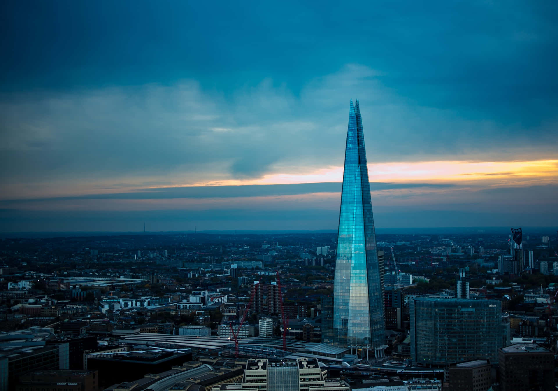 Caption: The Shard's Stunning Reflection Against The London Skyline