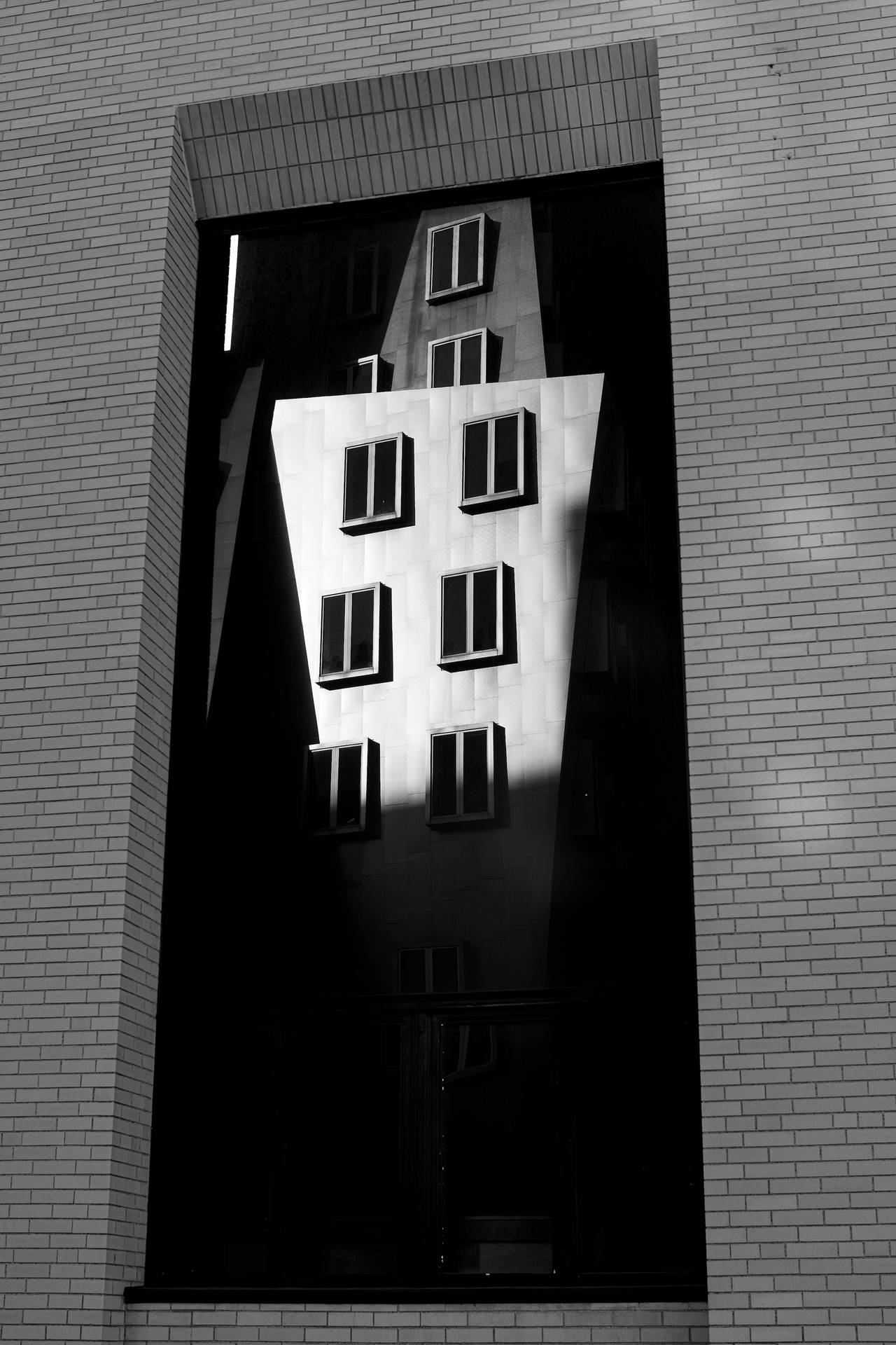 Caption: The Stata Center At The Massachusetts Institute Of Technology In Grayscale Background