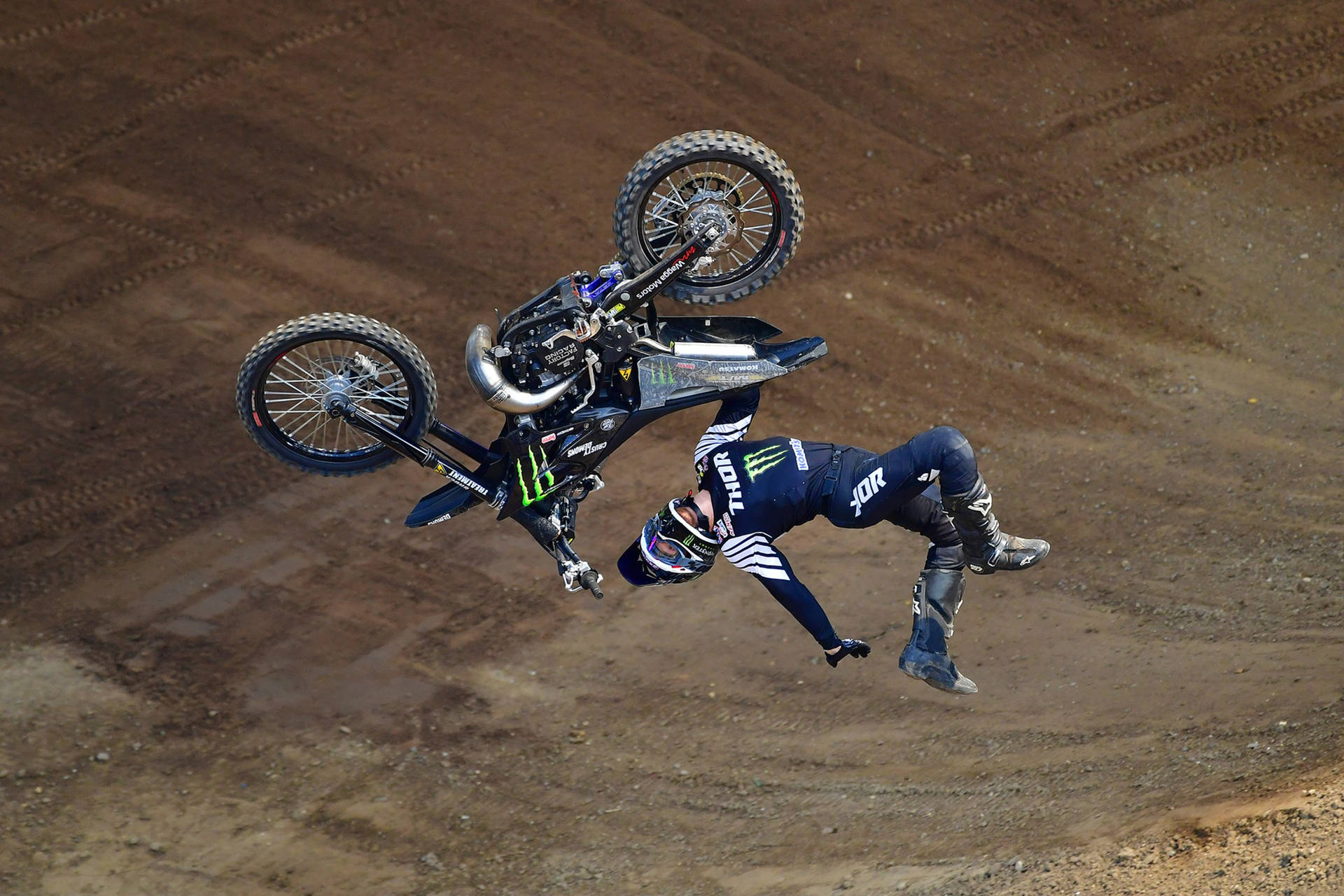 Caption: Thrill Of Backflip At X Games Motocross Event Background