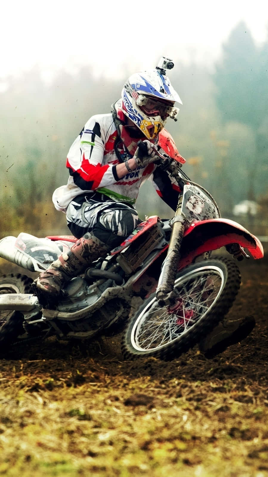 Caption: Thrilling Ride Through The Mud - Motocross Rider In Action