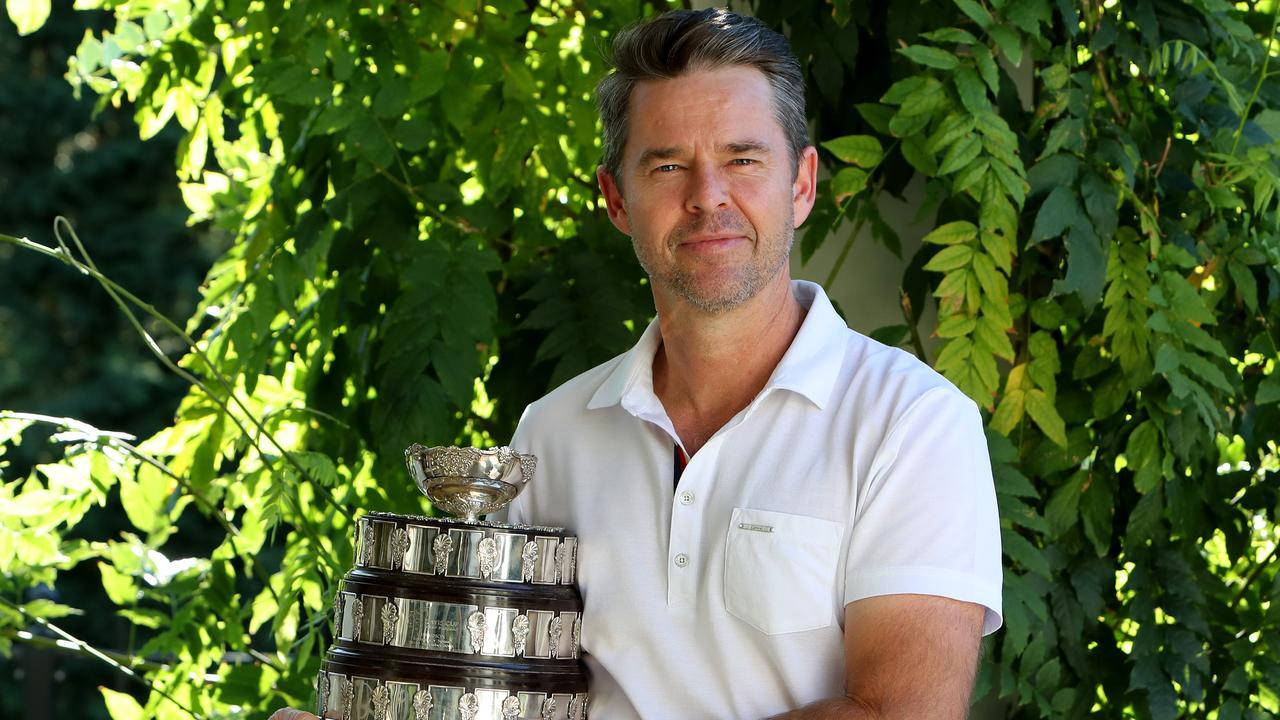 Caption: Todd Woodbridge Holding The Prestigious Davis Cup Background