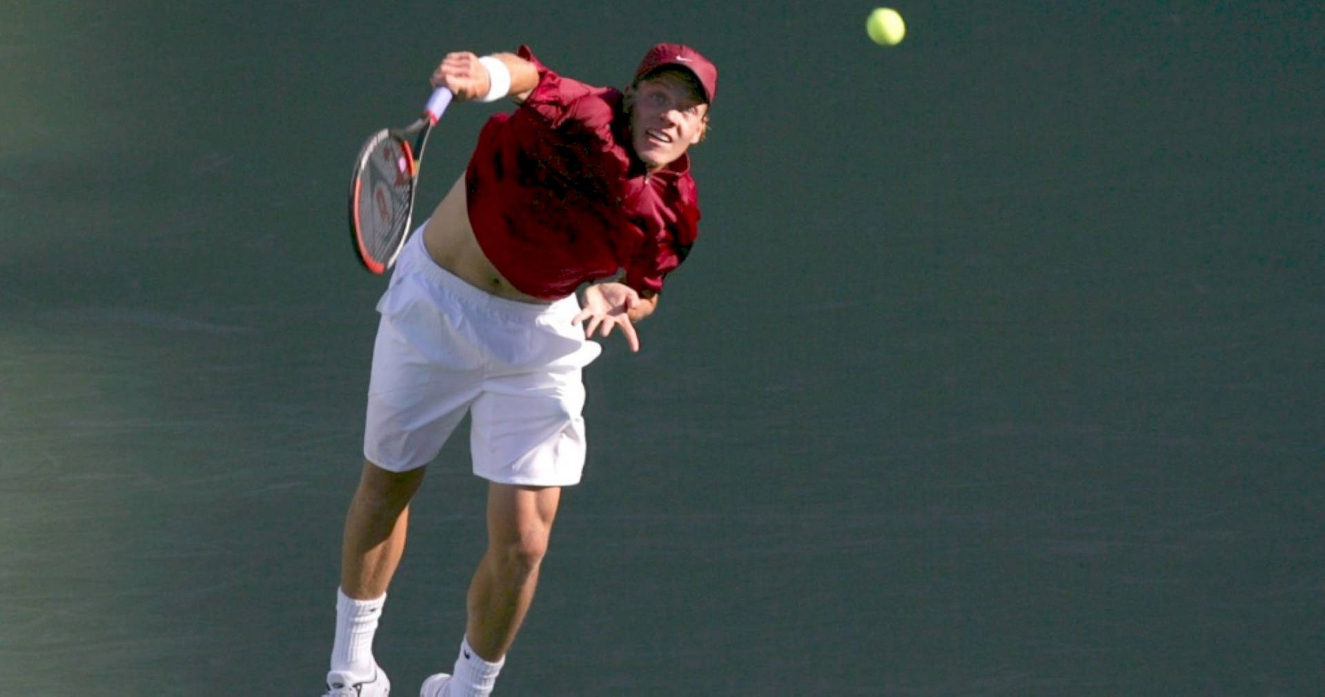 Caption: Tomas Berdych In Action - Smashing The Ball Mid-air Background