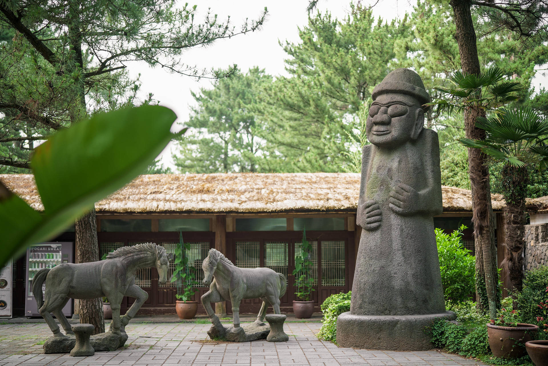 Caption: Traditional Jeju Island Folklore Village Background