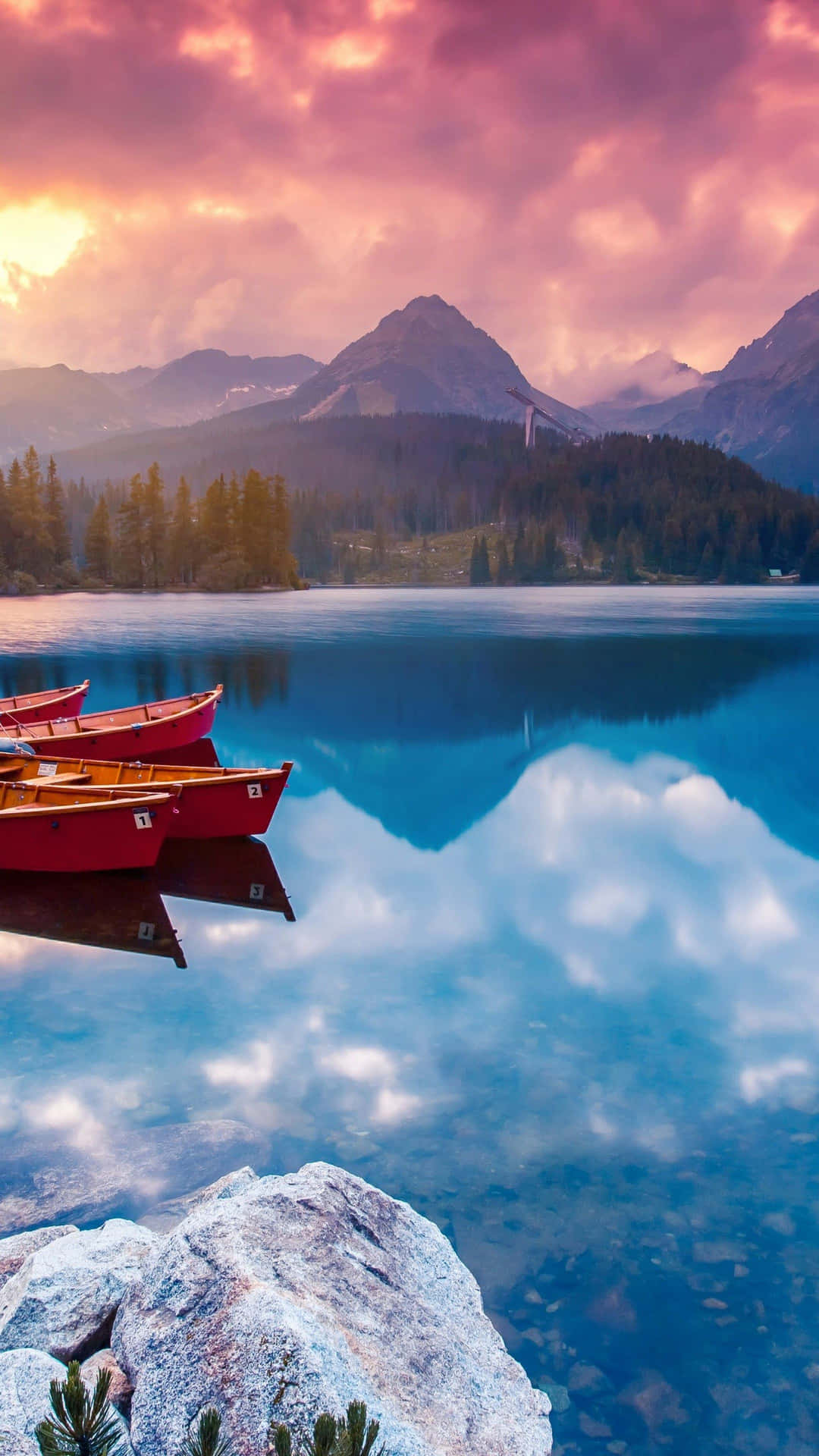 Caption: Tranquil Scene - Boats On Lake At Sunset Background