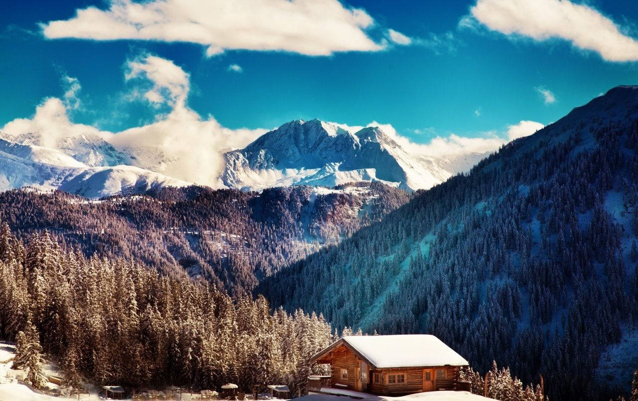 Caption: Tranquil Snowy Cottage In The Smoky Mountains Background