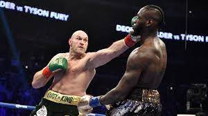 Caption: Tyson Fury Celebrating His Victory In The Ring Background