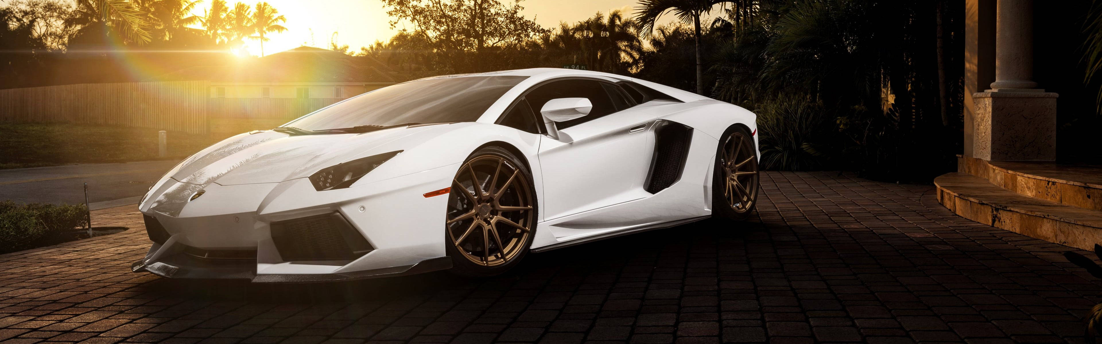 Caption: Unleashed Luxury - Lamborghini Aventador Sports Car Background