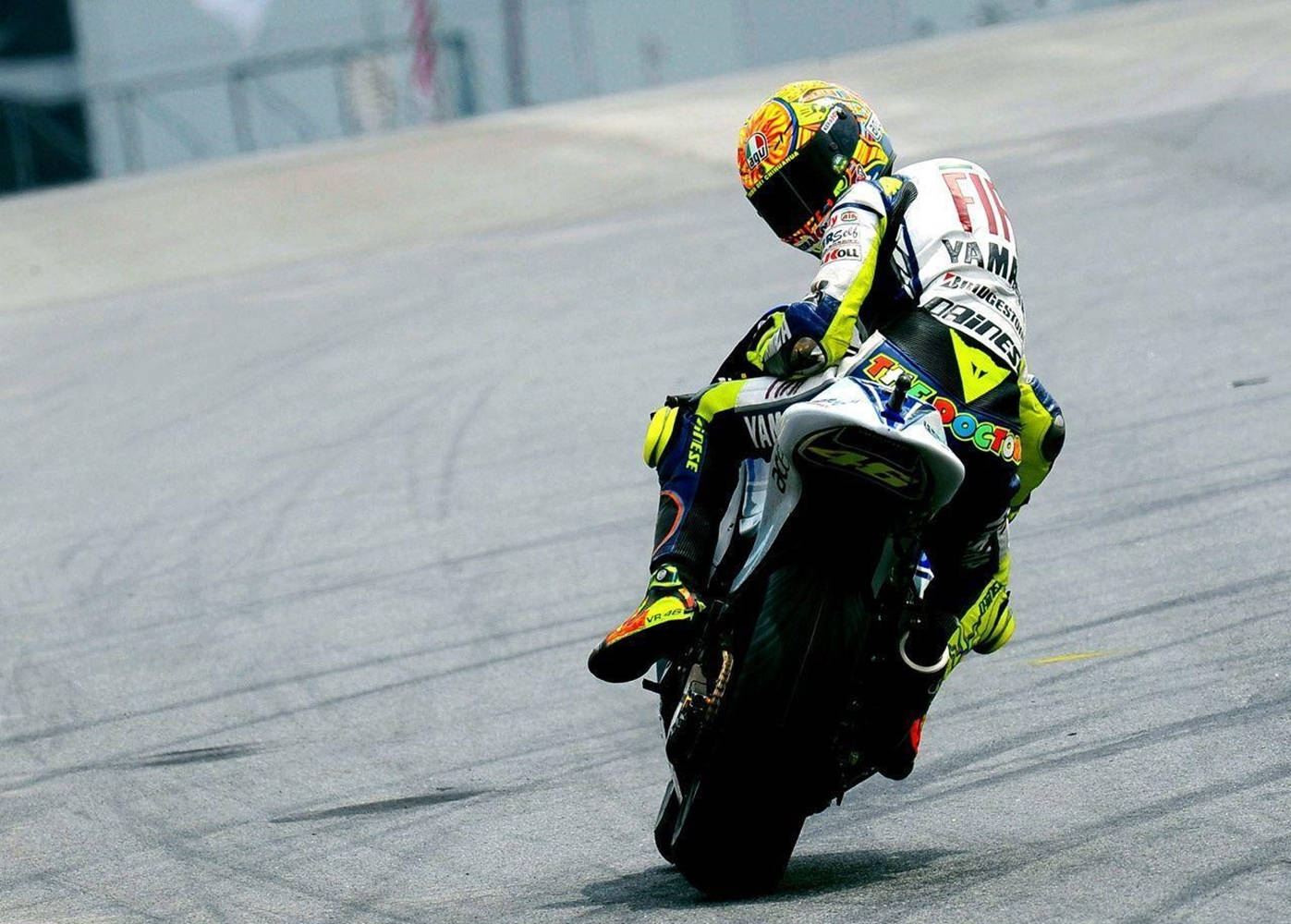 Caption: Valentino Rossi At 2015 Malaysia Grand Prix Background