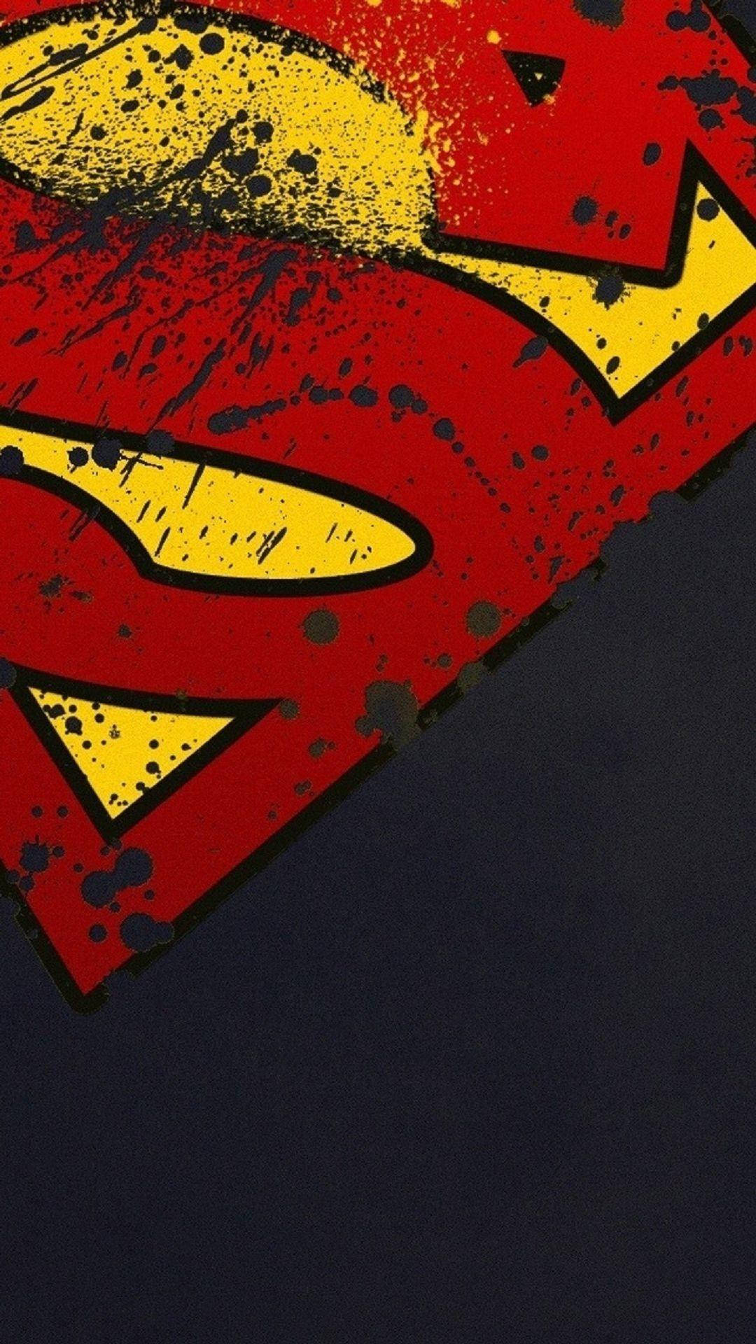 Caption: Valiant Superman Symbol On Iphone Background Background