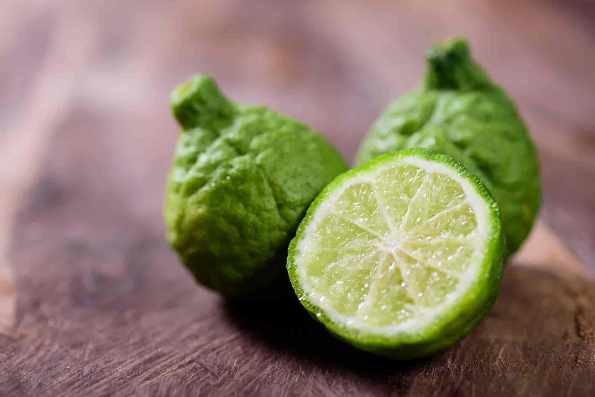 Caption: Vibrant Kaffir Lime - The Aromatic Citrus Fruit Background
