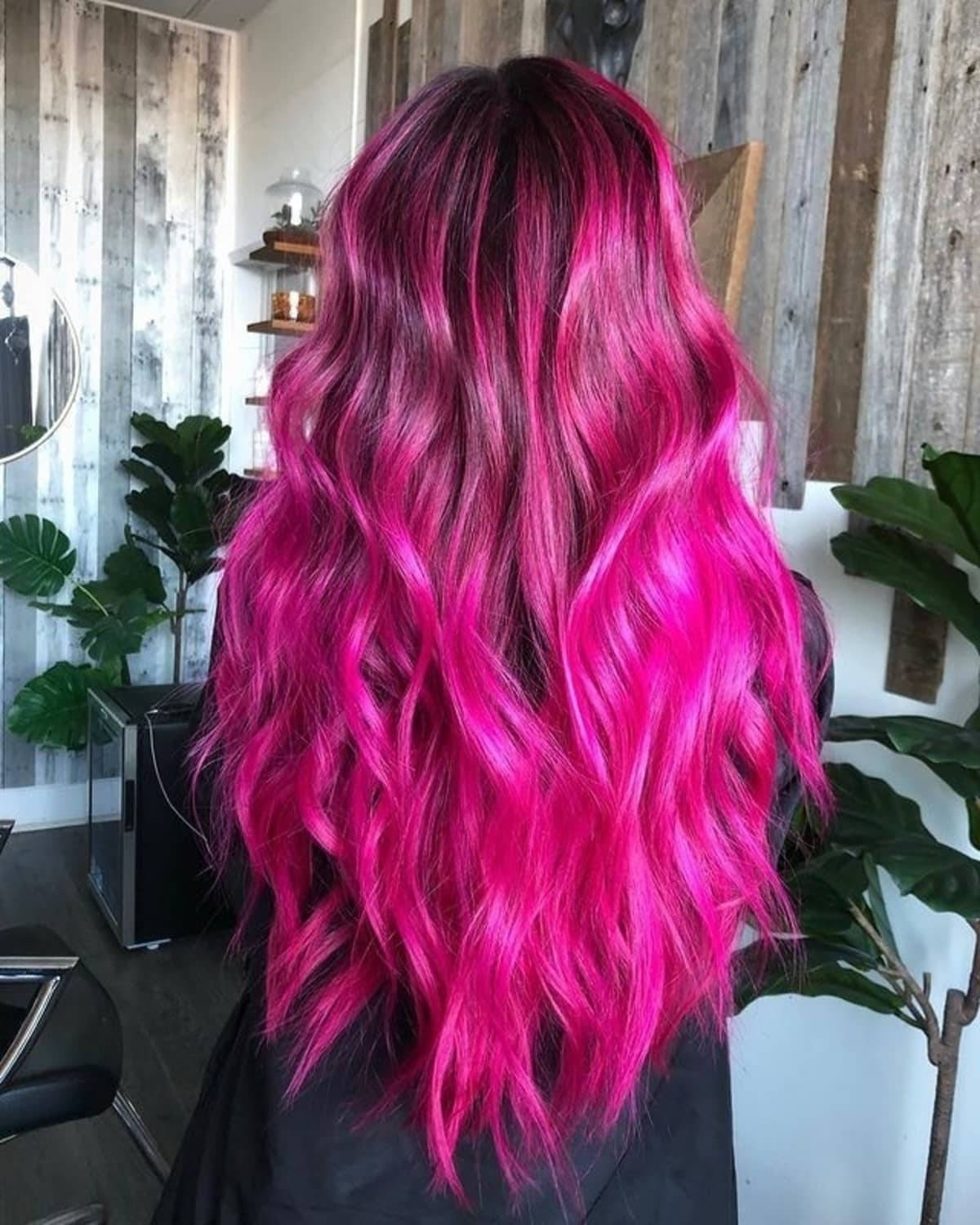 Caption: Vibrant Magenta Hair Waves Background