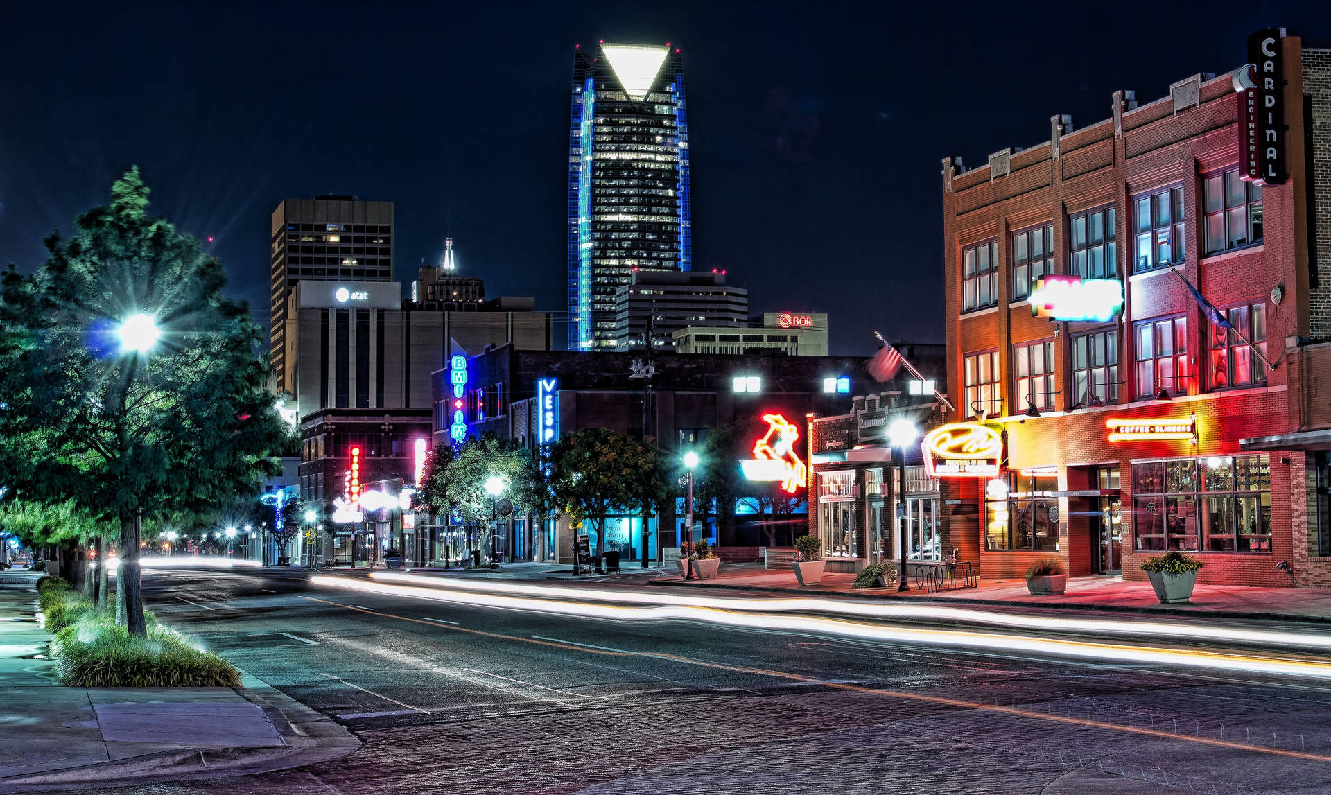 Caption: Vibrant Night View Of Automobile Alley In Oklahoma City. Background