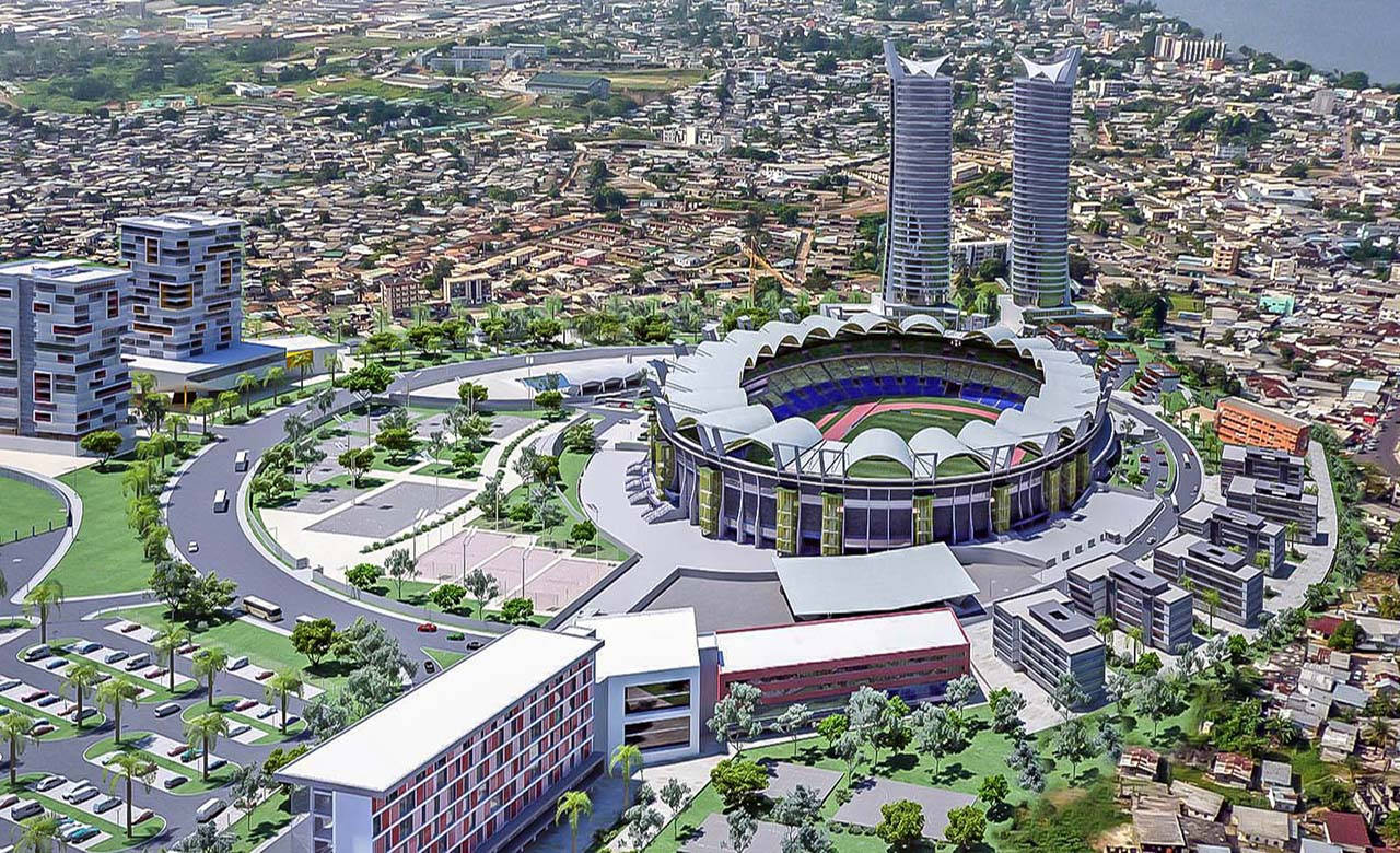 Caption: Vibrant Night View Of Stade Omnisports Stadium, Gabon Background