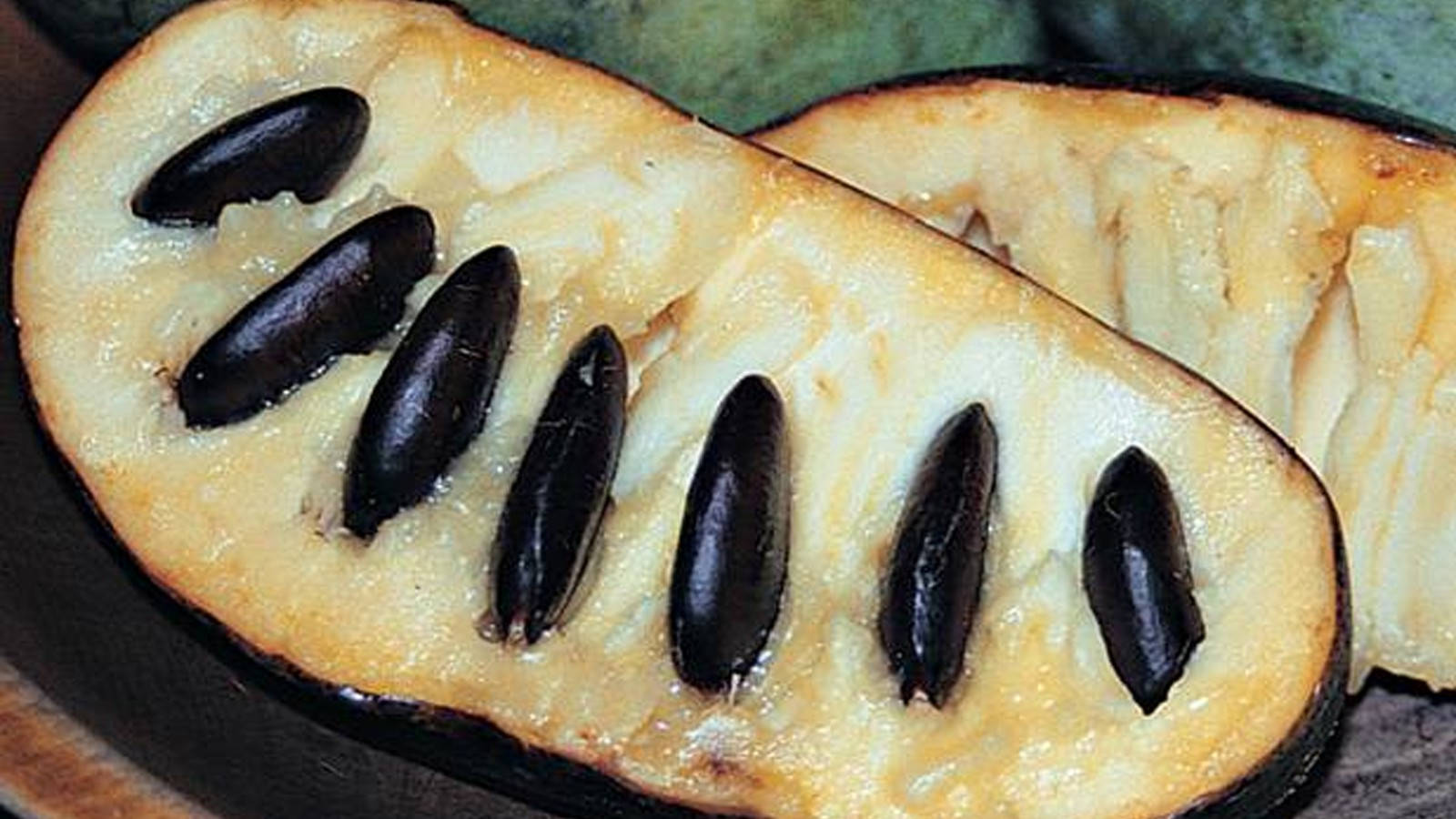 Caption: Vibrant Pawpaw Fruit With Black Seeds