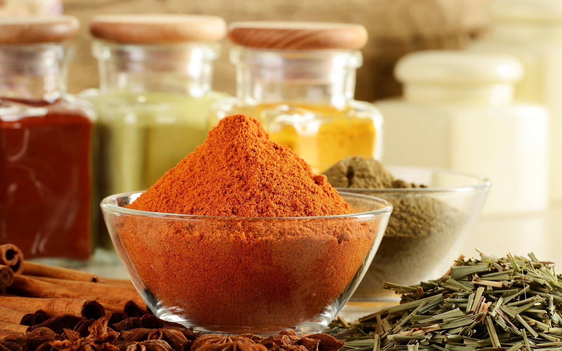 Caption: Vibrantly Colored Spices And Herbs In Glass Containers