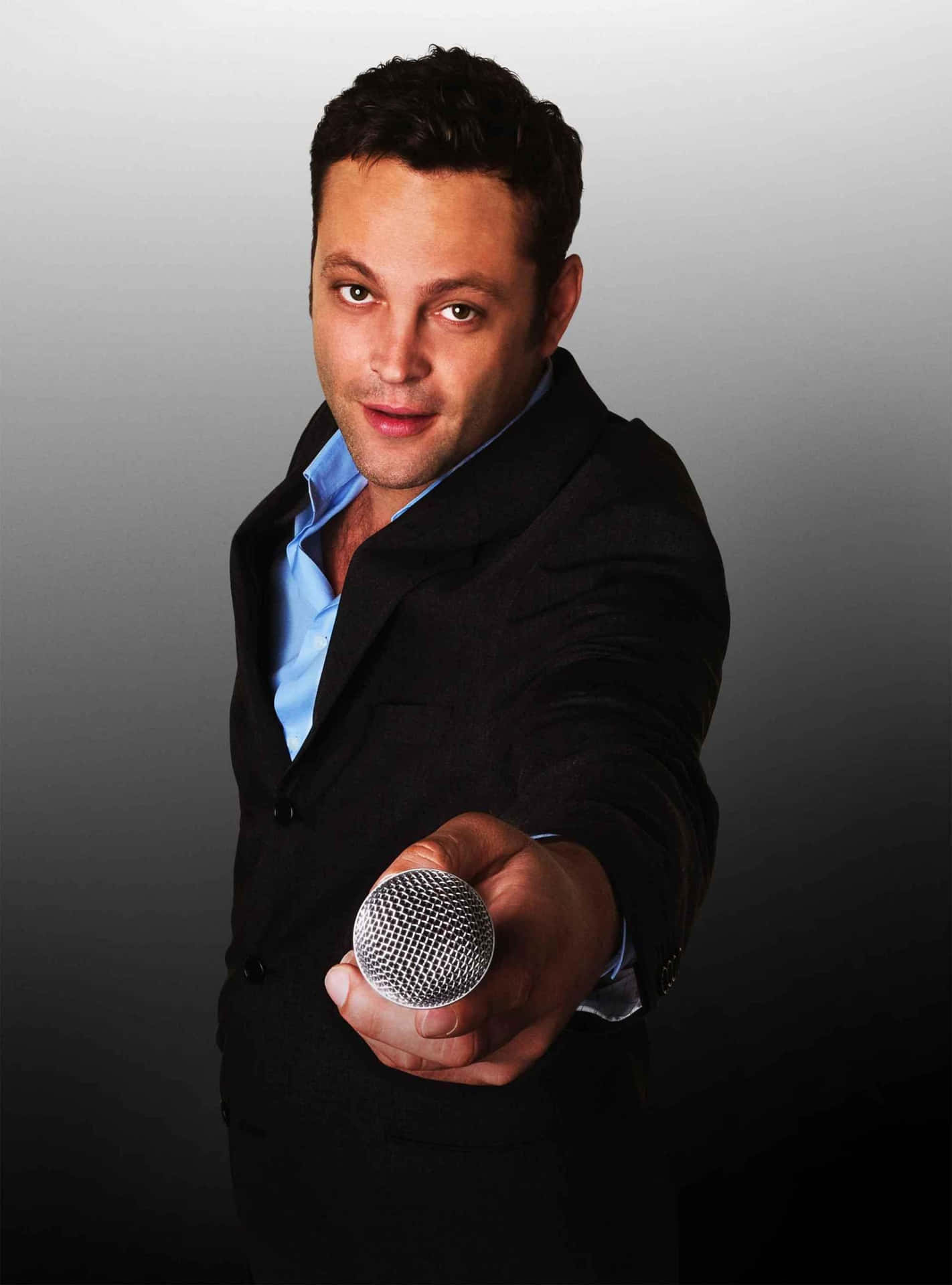 Caption: Vince Vaughn Posing For A Photoshoot Background