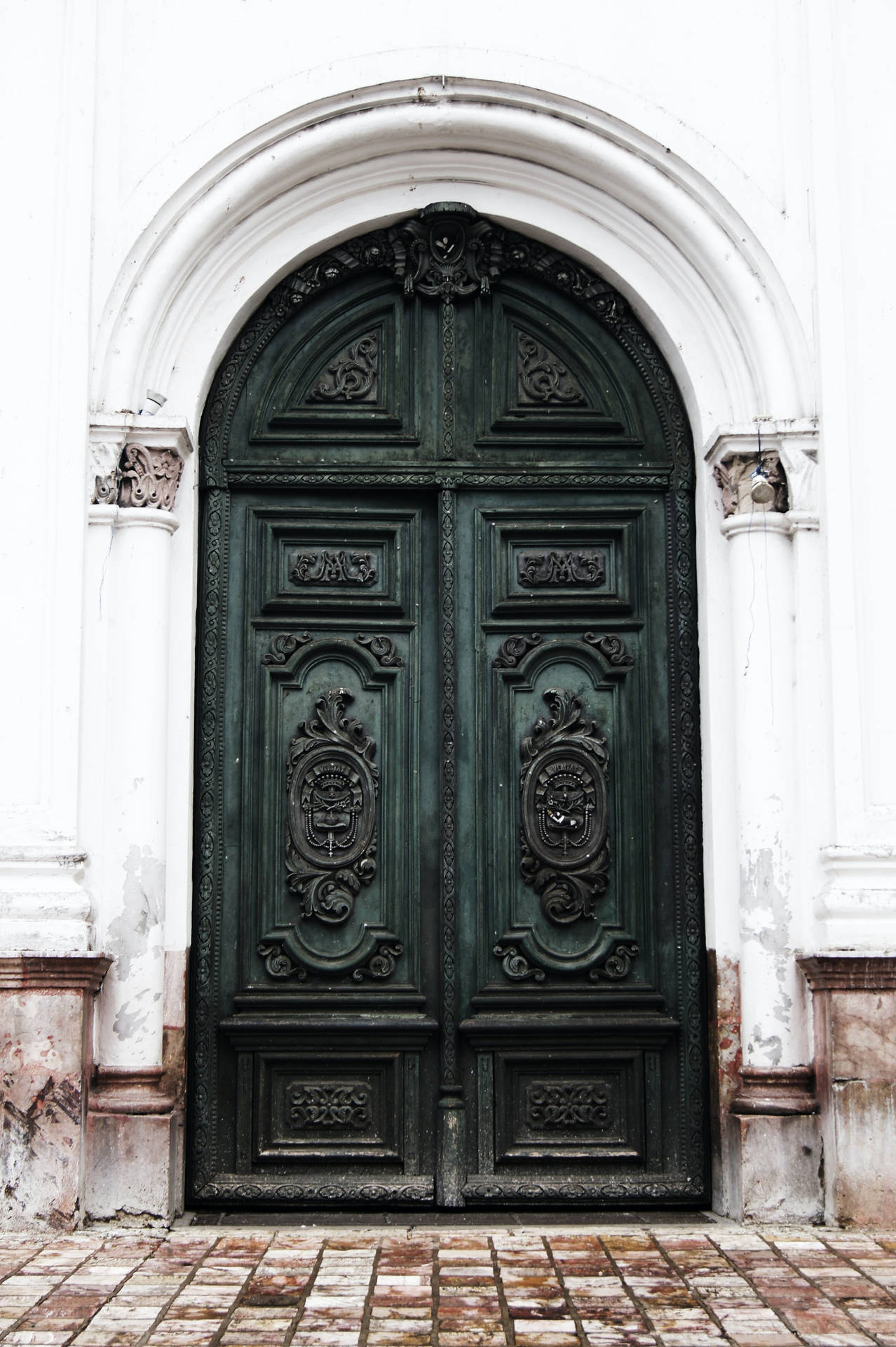 Caption: Vintage Carved Green Double Doors Background