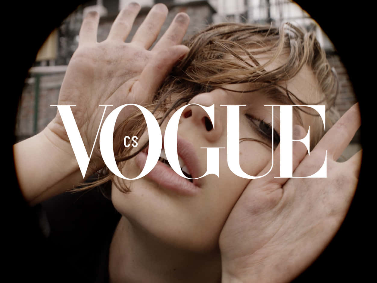 Caption: Vogue's Iconic Logo Represented In Artistic Monochrome Background