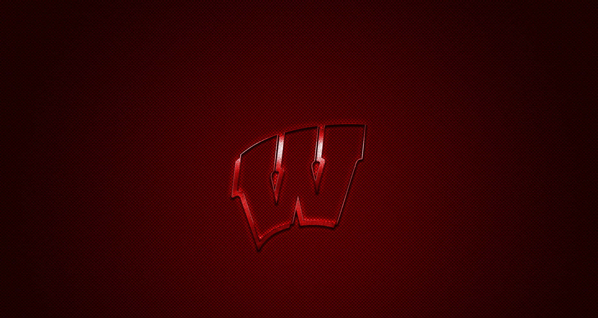 Caption: Wisconsin Badgers Football Team In Action Background