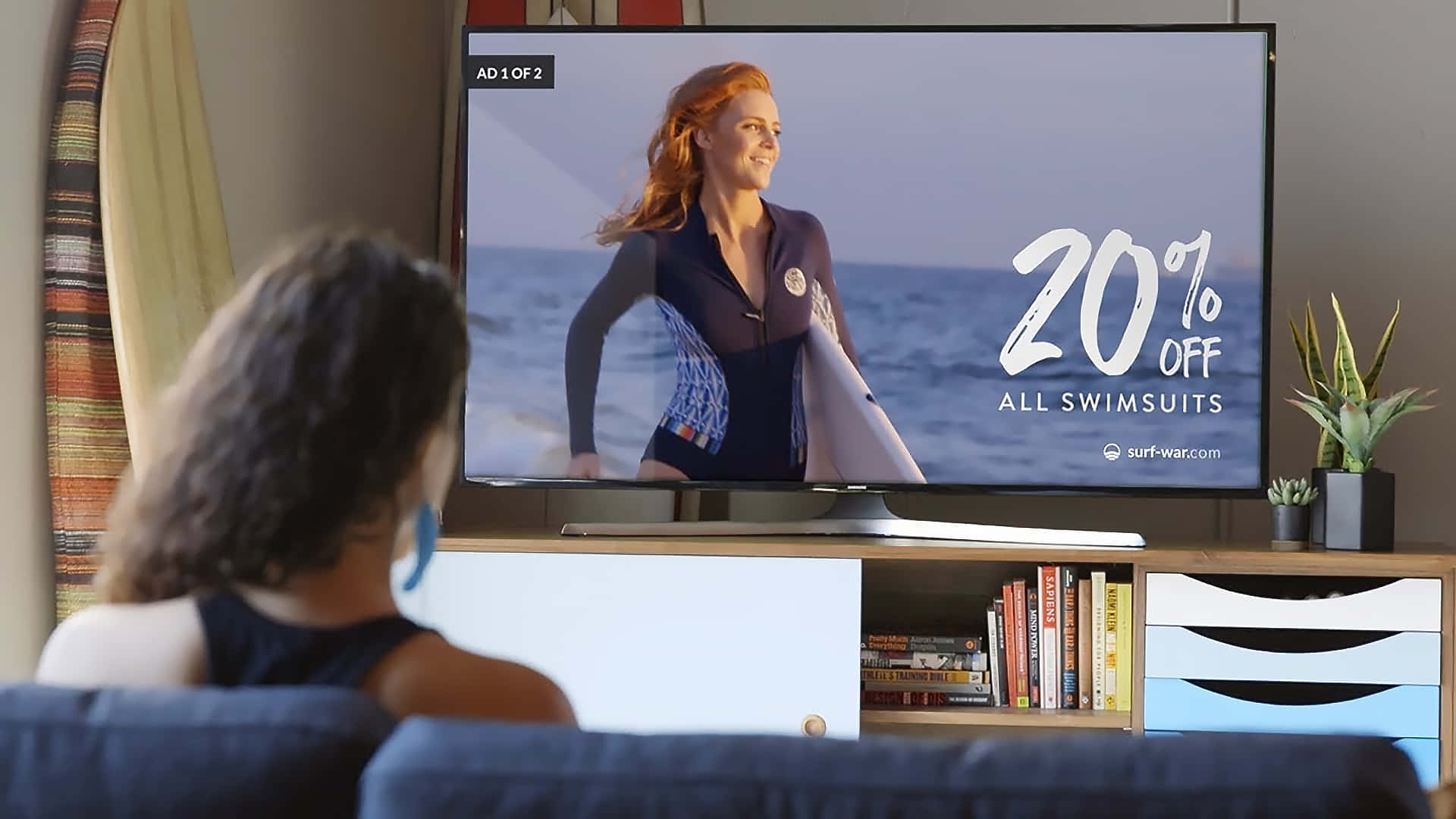 Caption: Woman Engrossed In A Swimsuit Commercial Background