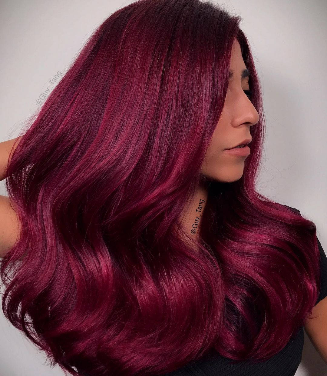 Caption: Woman With Magenta Hair Side View Background