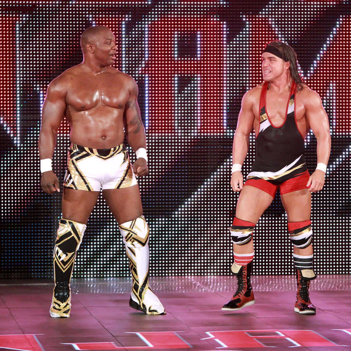 Caption: Wrestling Champions - Shelton Benjamin And Chad Gable Against The Ascension Background