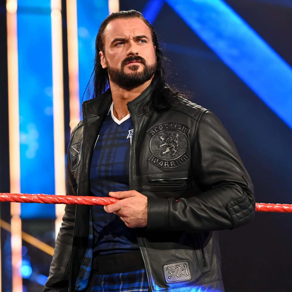 Caption: Wwe's Drew Mcintyre Sporting Leather Fashion Background