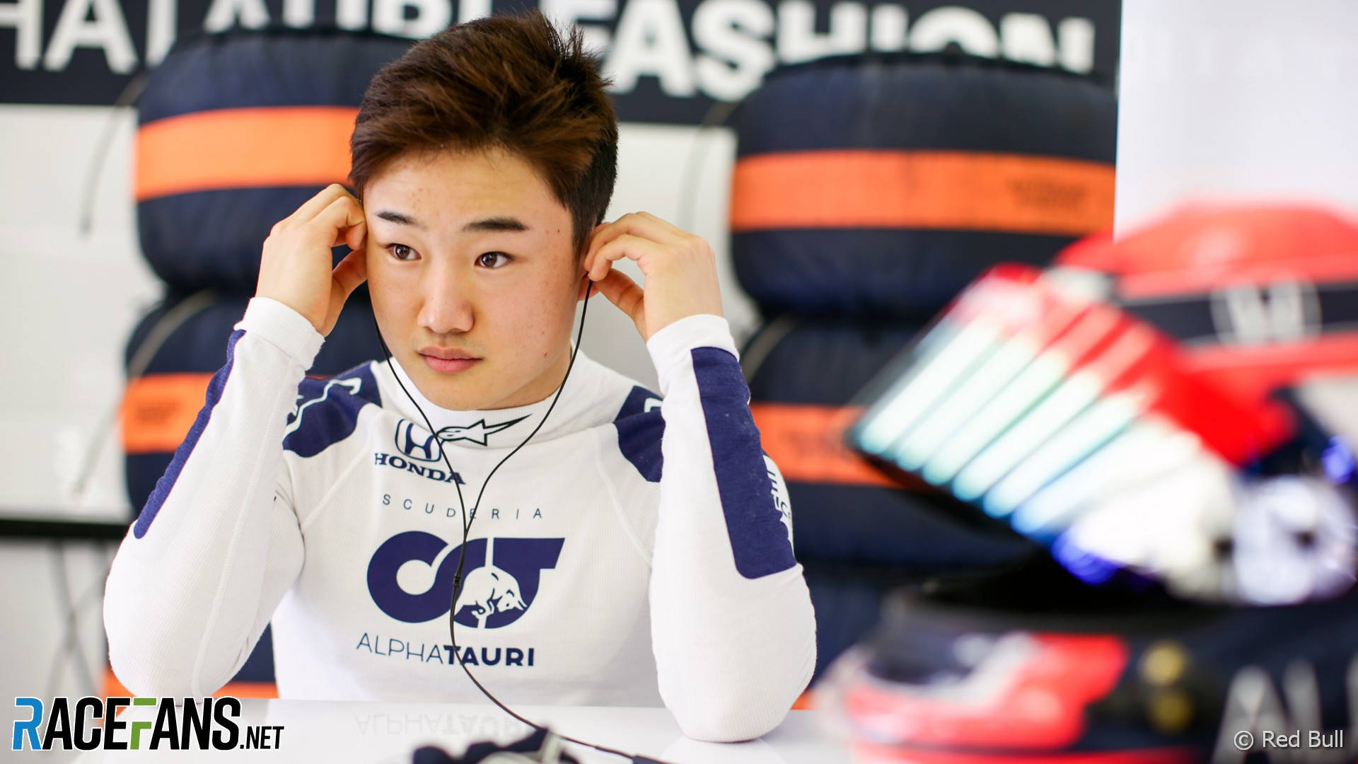 Caption: Yuki Tsunoda Navigating His Formula 1 Car.