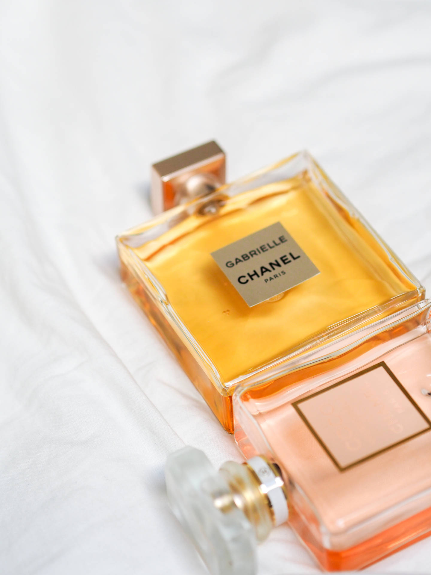 Captivating Ambience Surrounding Exquisite Perfumes From Chanel Background
