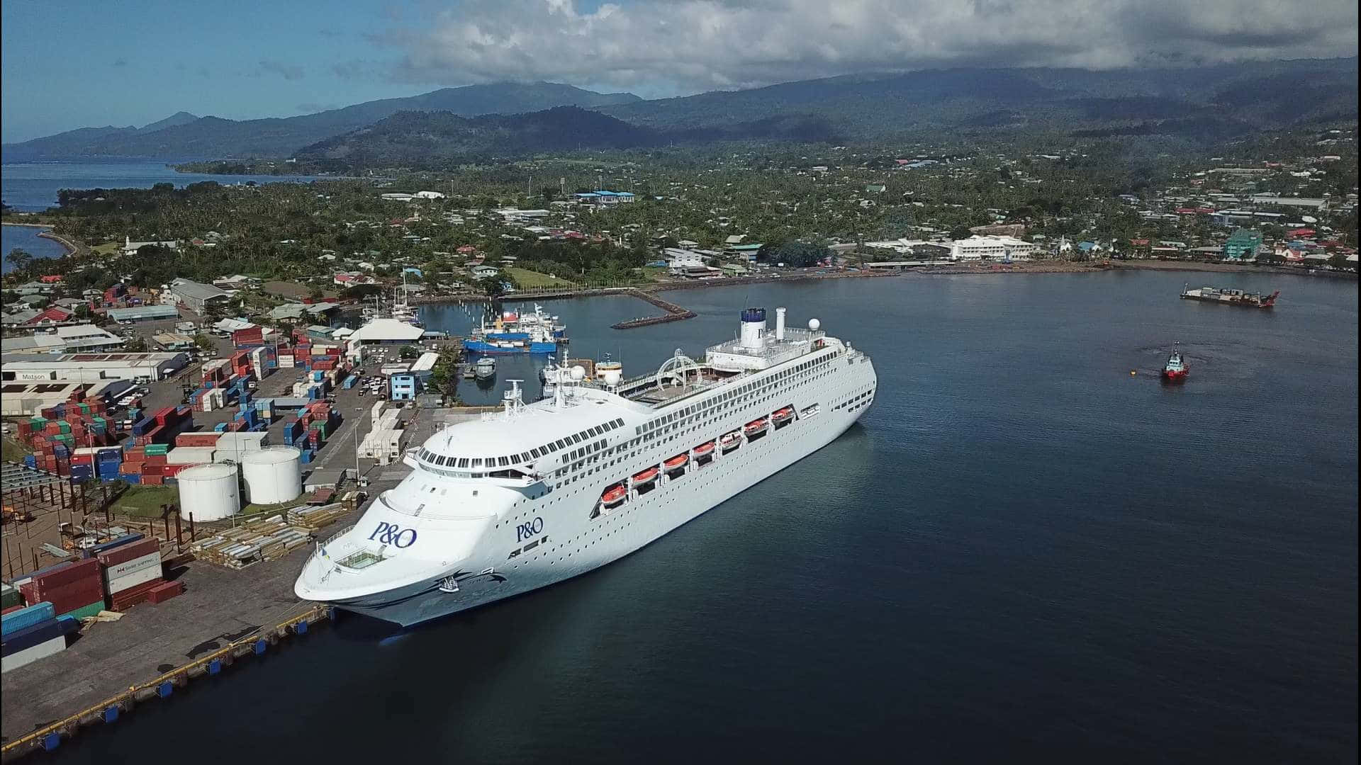 Captivating Apia: Majestic White Ship At Sundown Background