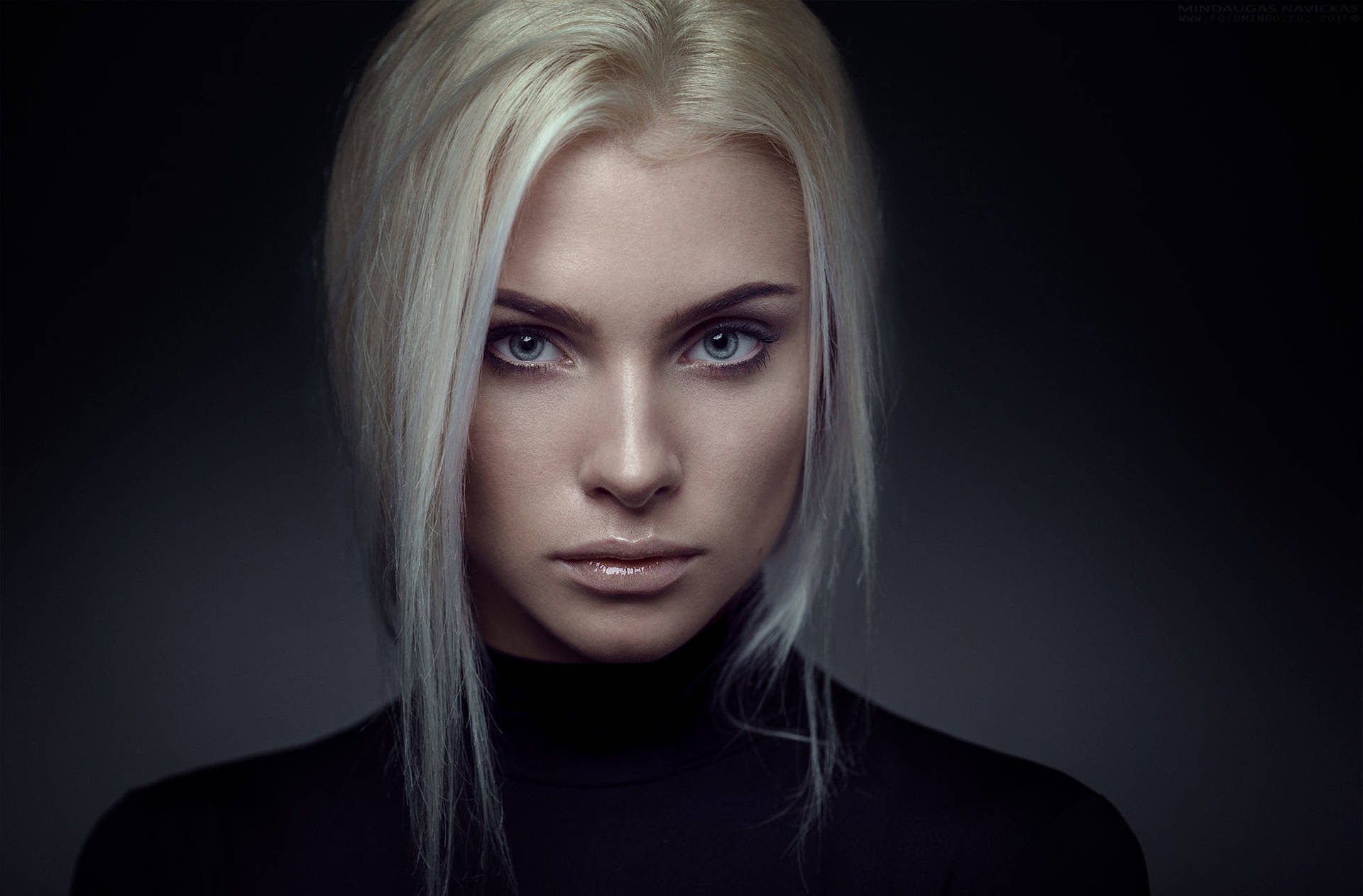 Captivating Blonde Female Model In Black And White Background