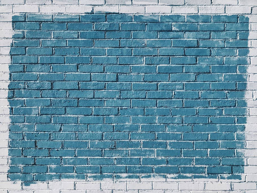 Captivating Blue Paint On A Brick Wall Background