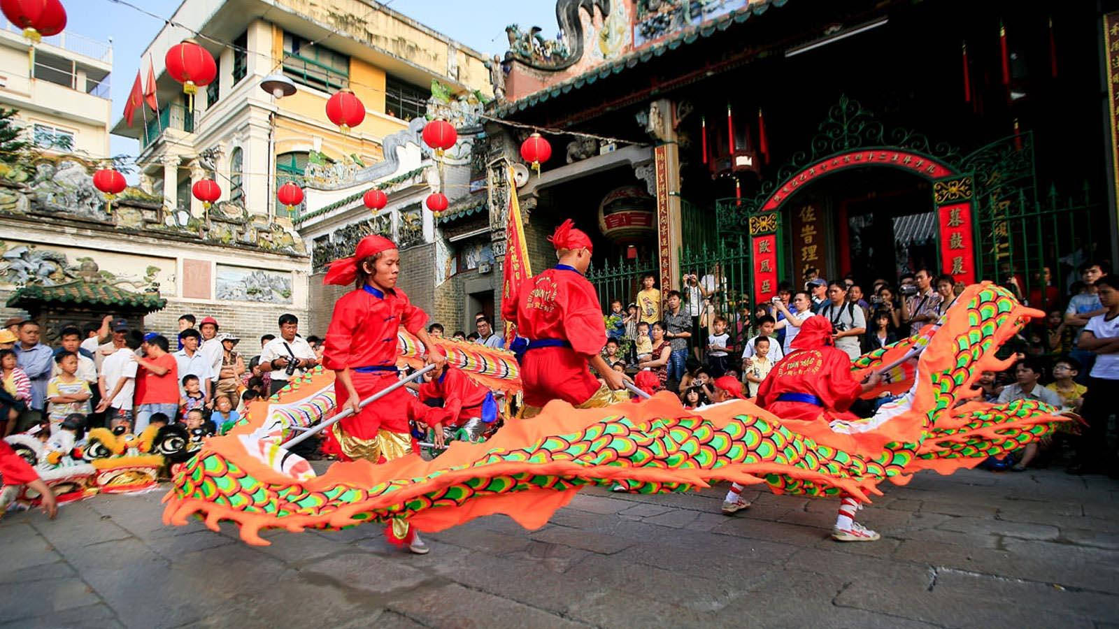 Captivating Dragon Dance Performance In Ho Chi Minh City Background