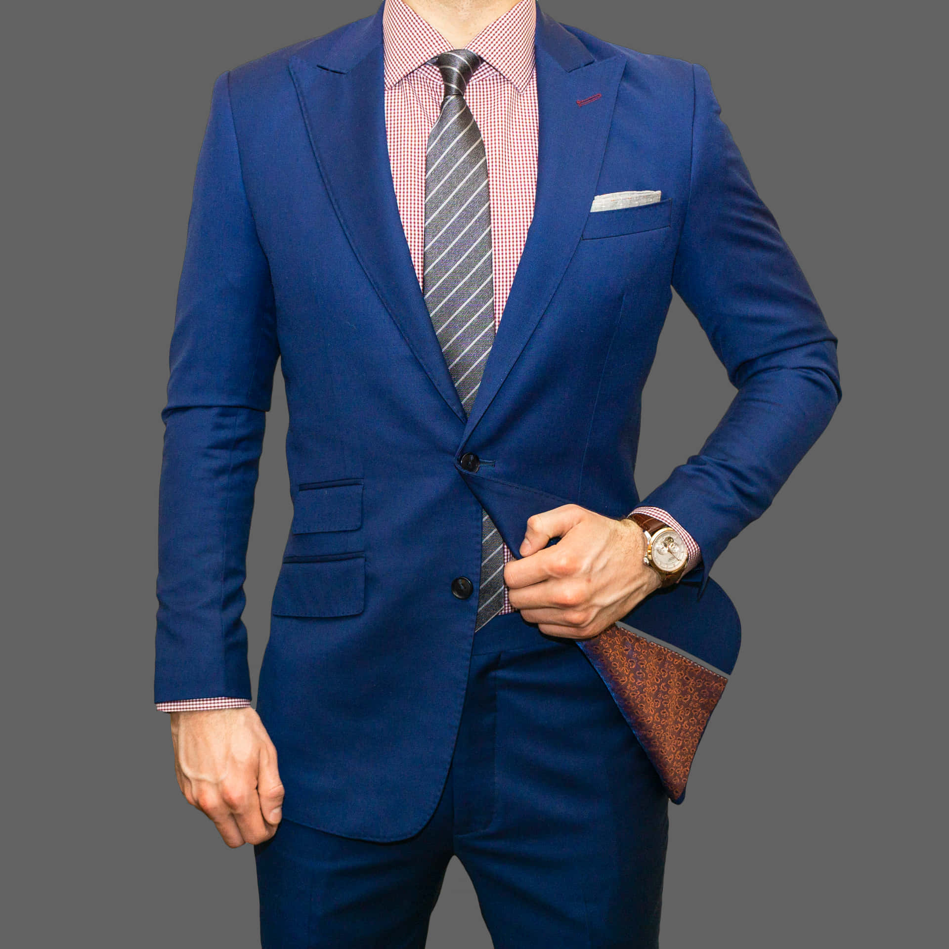 Captivating Elegance In A Blue Men's Suit Background