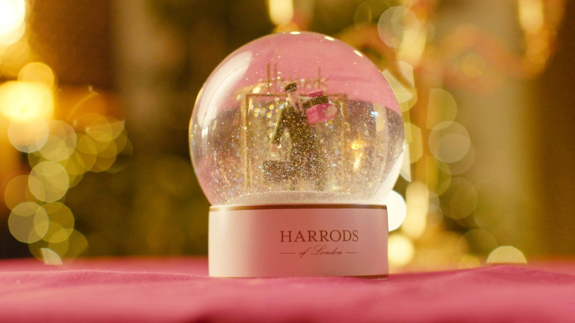 Captivating Harrods Snow Globe In Winter Background