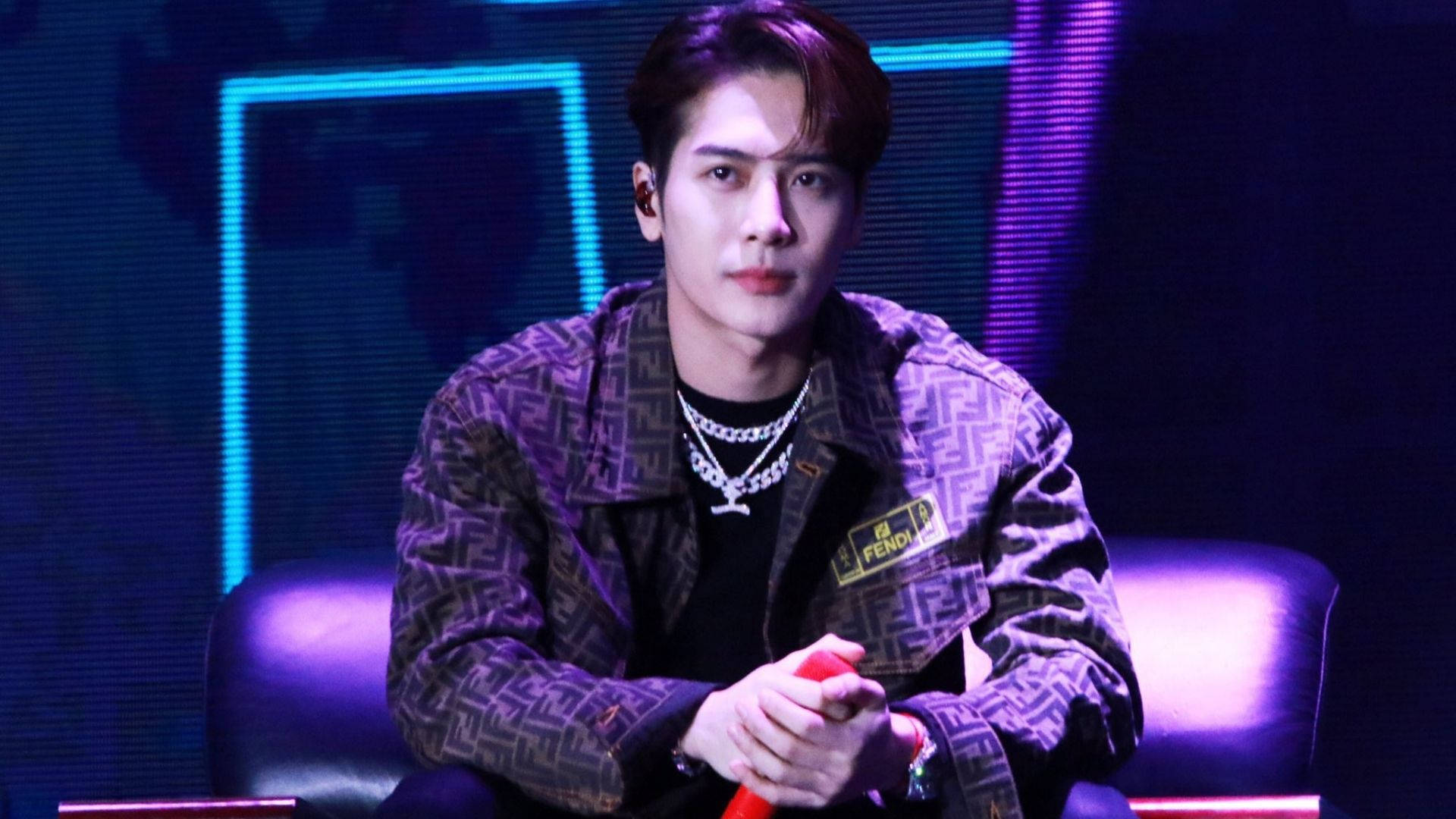 Captivating Jackson Wang In An Elegant Stance Background