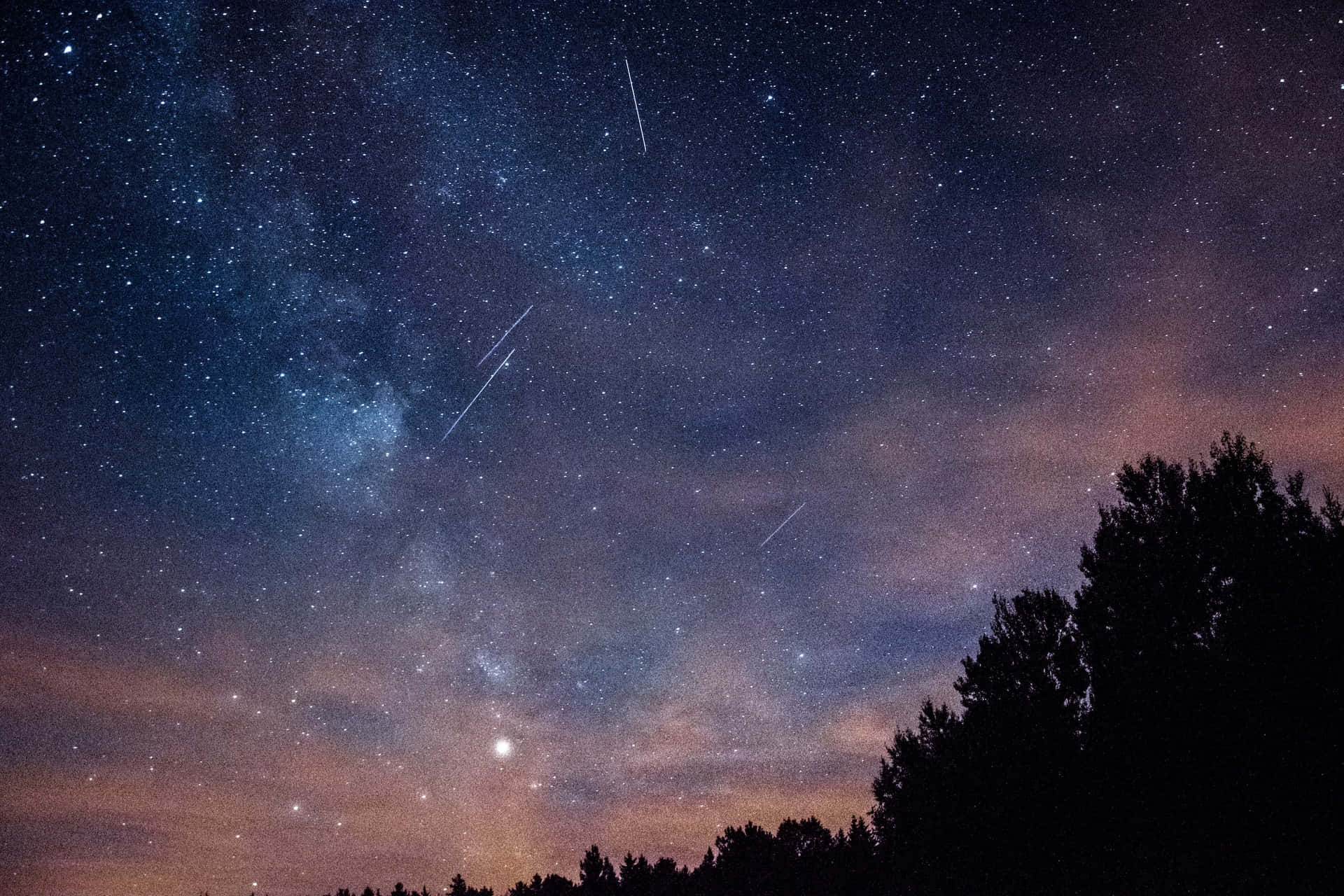 Captivating Meteor Shower In A Starry Night Sky