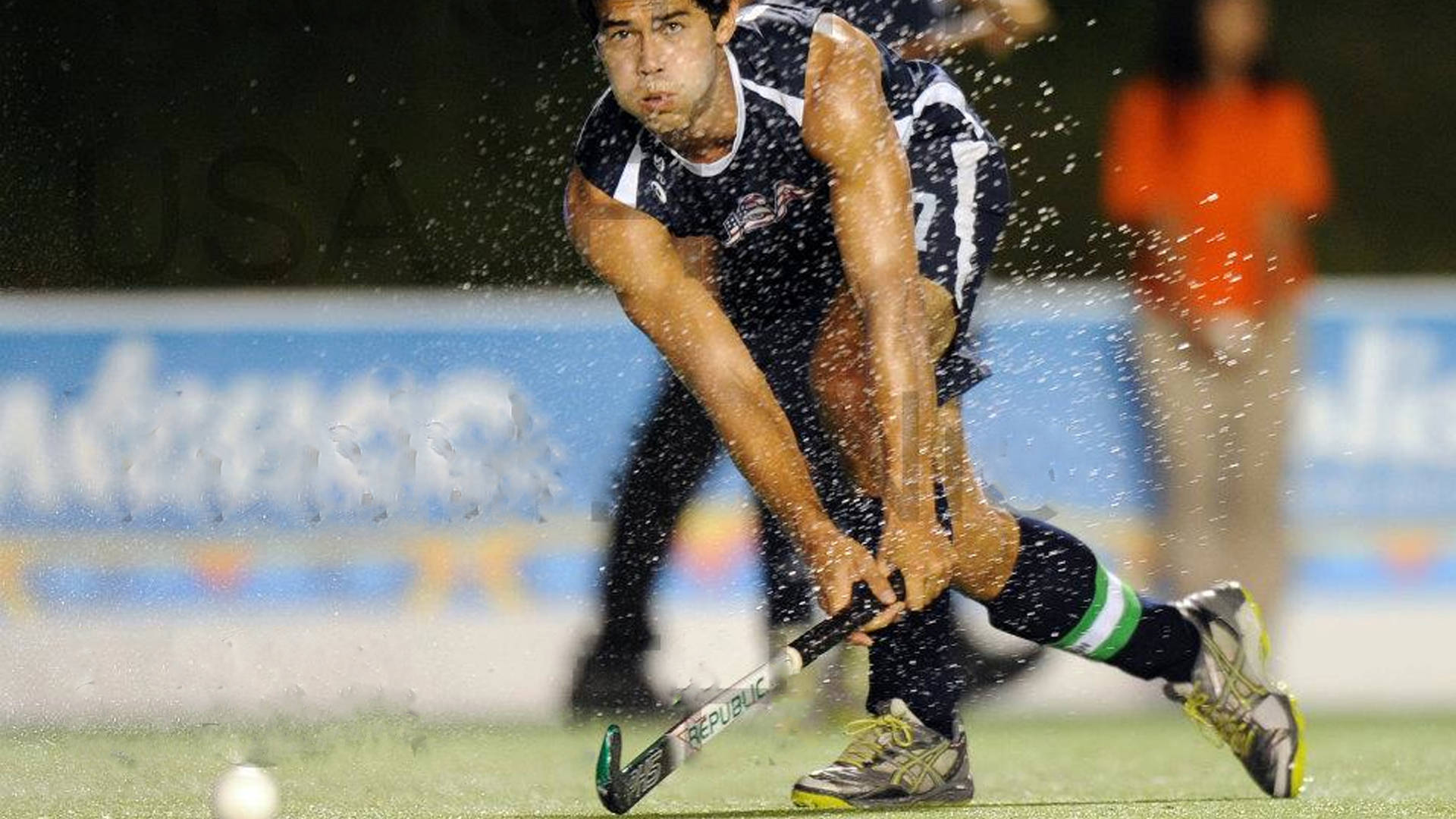 Captivating Moment In Field Hockey Background