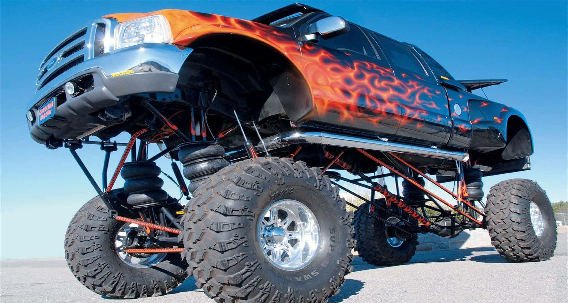 Captivating Monster Truck Action Background