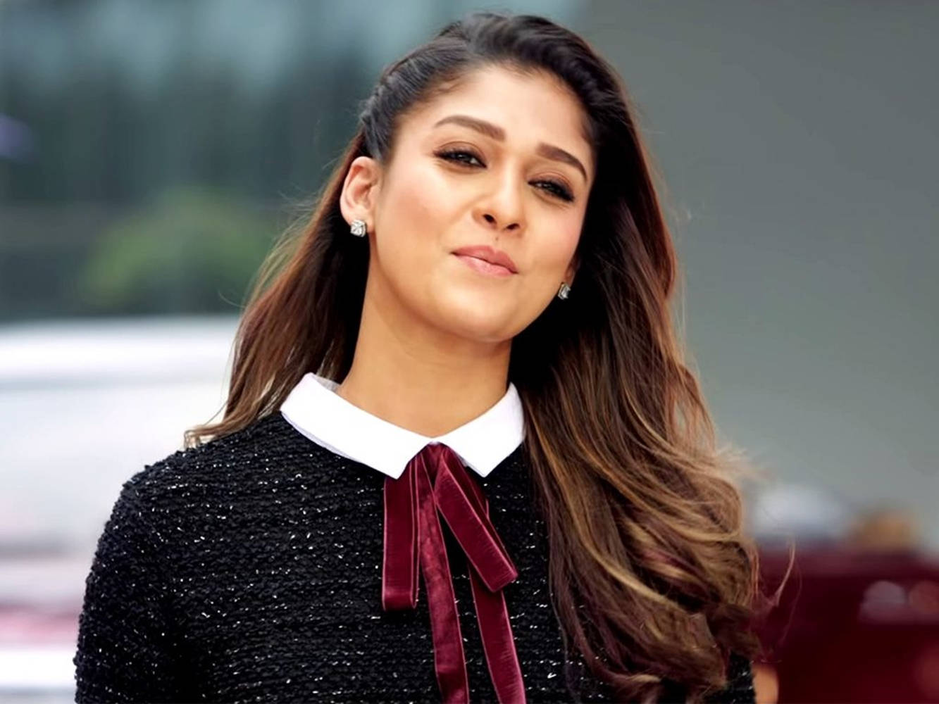 Captivating Nayanthara In A Stylish Black Ensemble With A Red Tie