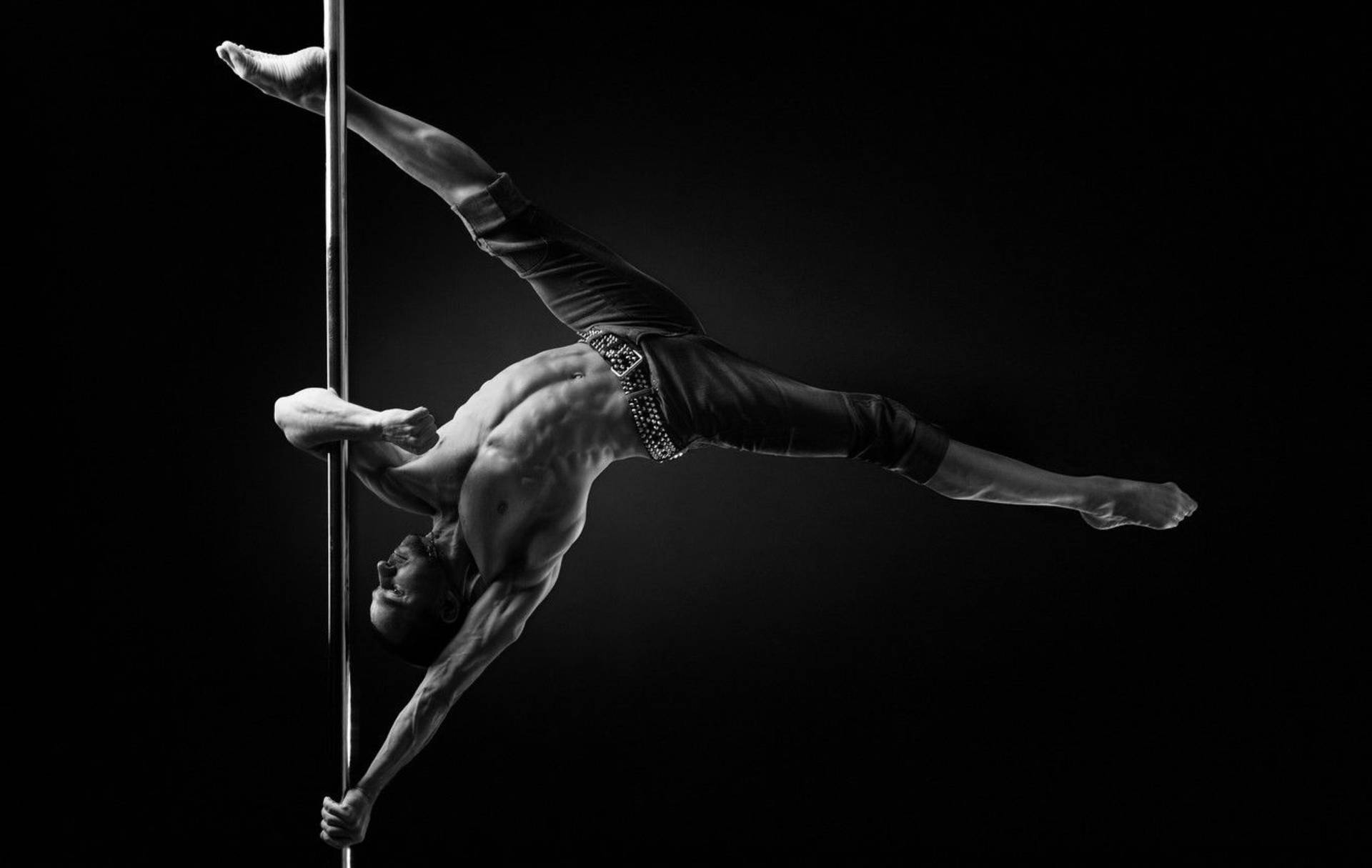 Captivating Pole Dancer Demonstration Background